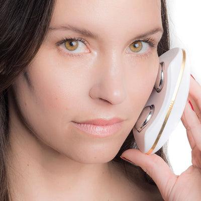 Female model using the ZIIP Beauty Nanocurrent Device Facial at Home